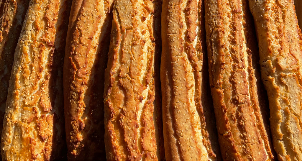 A line of fresh-baked baguettes of Dutch crunch